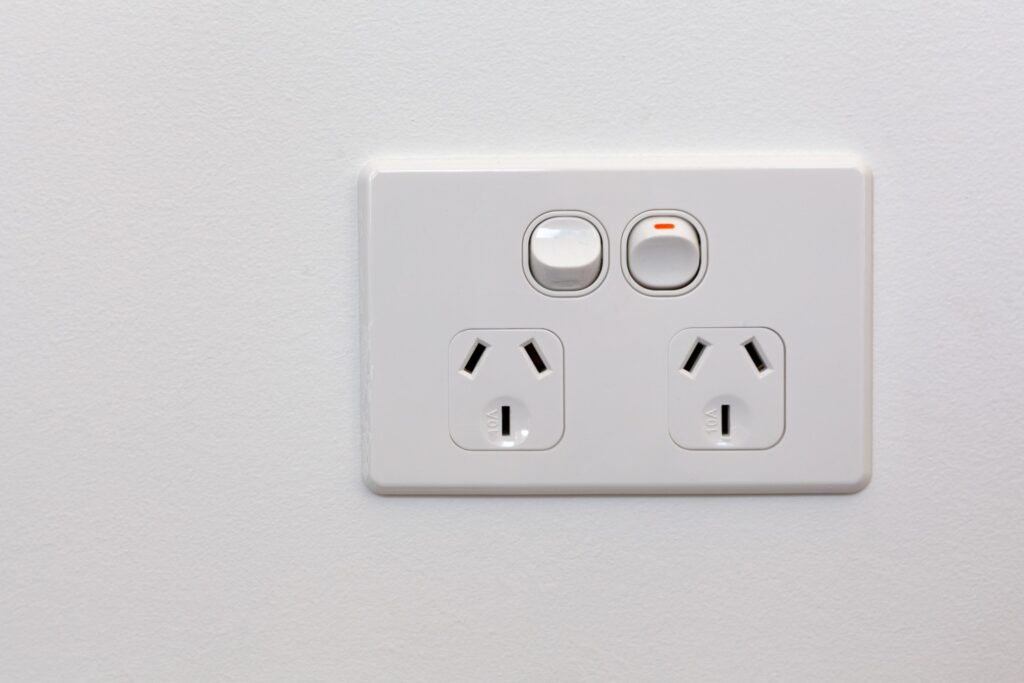 Modern Australia double power outlet on white wall