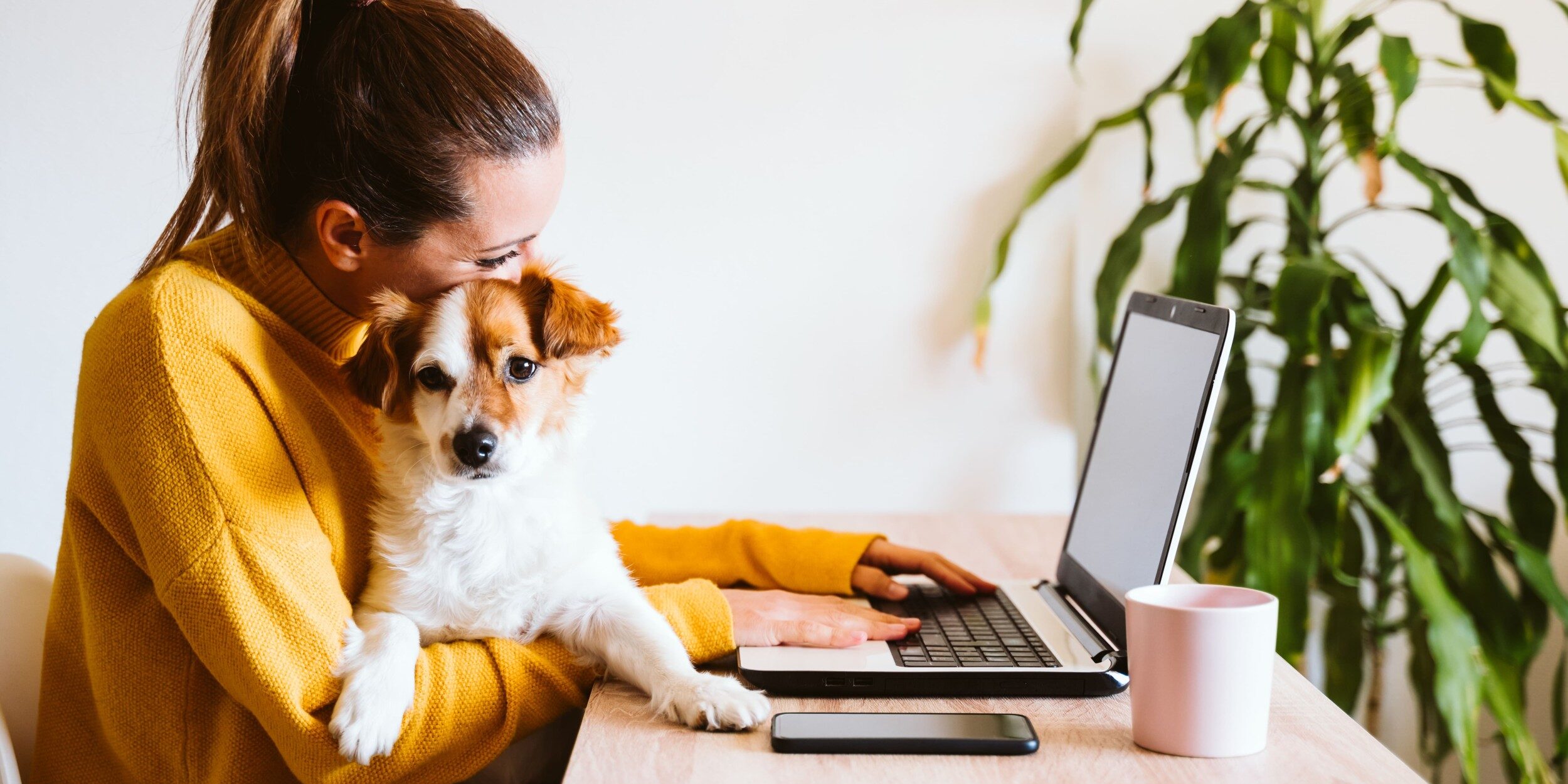 female working from home with dog